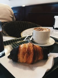 Close-up of coffee cup on table