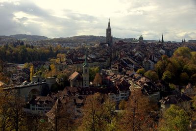 View of town against cloudy sky