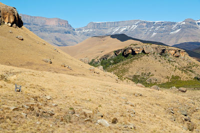 Scenic view of mountains against clear blue sky