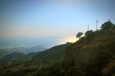 Scenic view of landscape against sky at sunset