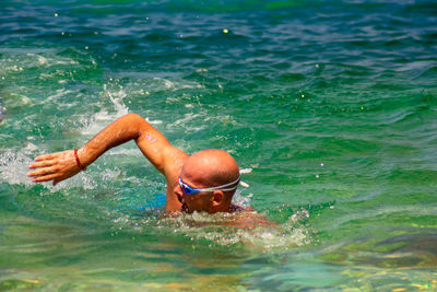 Man swimming in sea