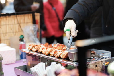 Close-up of man preparing food