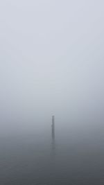 Scenic view of fog over water