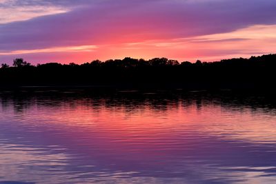 Scenic view of lake against romantic sky at sunset