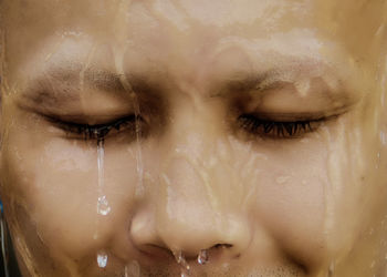 Close-up portrait of woman with eyes closed