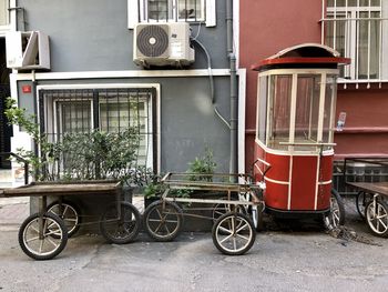 Bicycle parked against wall in city