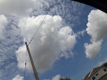 Low angle view of wind turbine against sky