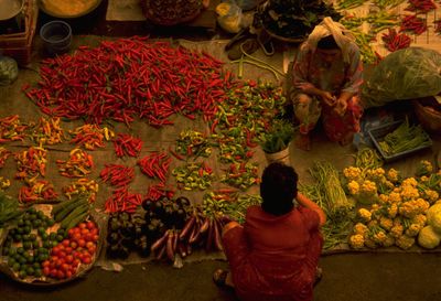 Rear view of people at market stall