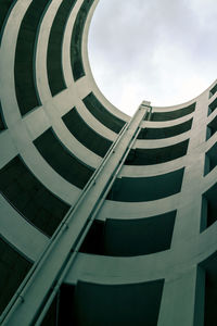 Abstract geometry perspective of spiral ramp slope for parking space at a building for background