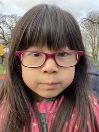 Portrait of cute girl wearing eyeglasses