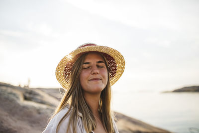 Young woman wearing hat