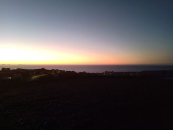 Scenic view of silhouette landscape against sky during sunset