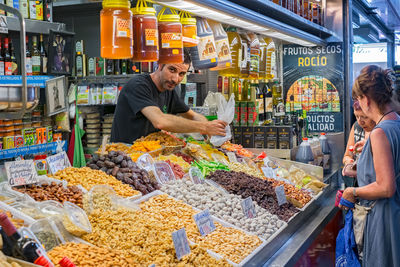 People at market stall