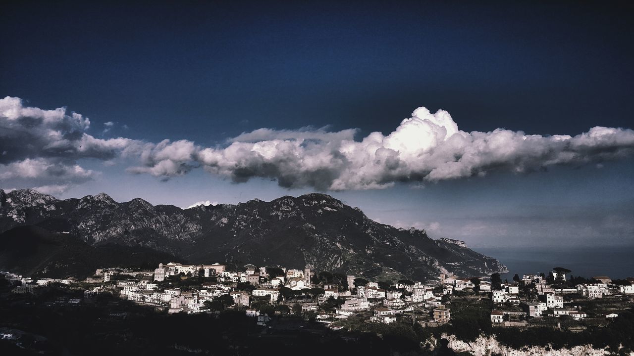 building exterior, sky, architecture, built structure, cloud - sky, city, residential district, nature, building, town, no people, day, cityscape, mountain, outdoors, blue, community, high angle view, townscape, settlement