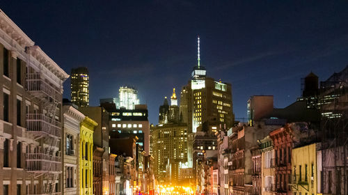 Illuminated buildings in city at night