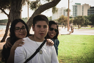 Happy group of latinos young people smiling at camera outdoors