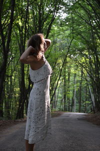 Woman standing in a forest