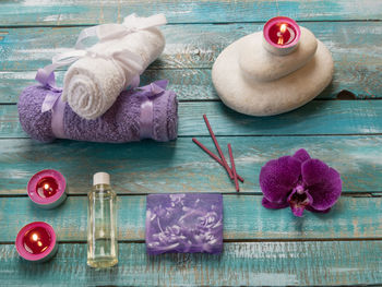 High angle view of beauty spa products on wooden table