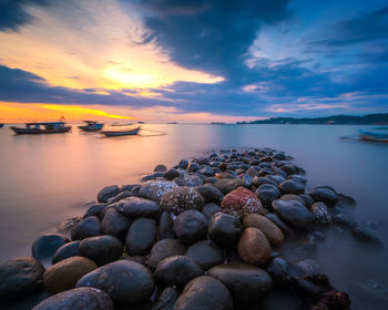 Scenic view of sea against sky during sunset