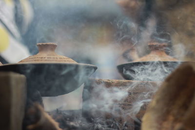 Close-up of food cooking in container outdoors