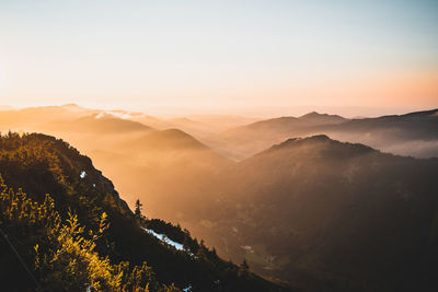 Scenic view of mountains against sky during sunset