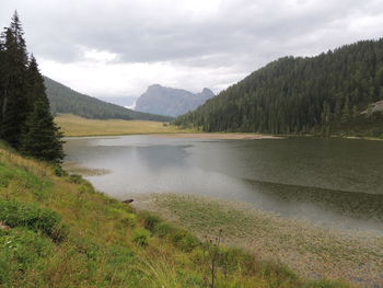 Scenic view of lake and mountains against sky