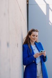 Woman using internet banking mobile app. isolated background. vertical photo