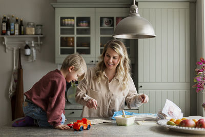 Mother with son in kitchen