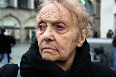 Close-up of senior woman in city