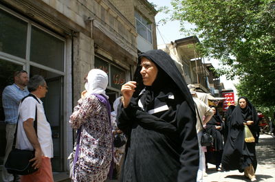 People standing on street in city