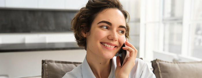 Young woman using mobile phone