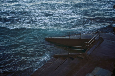 High angle view of steps by sea