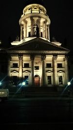 Low angle view of illuminated building at night