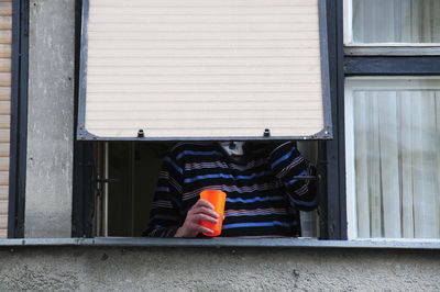 Low section of person standing on wall