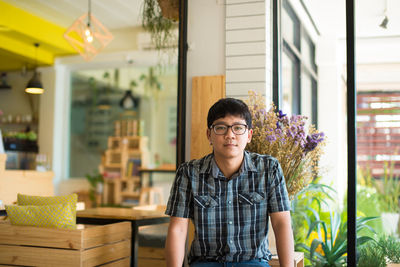 Portrait of man sitting in cafe