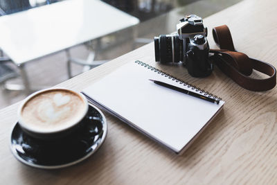 High angle view of coffee cup on table