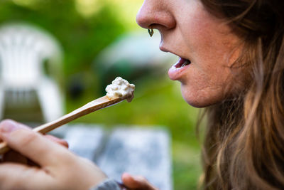 Close-up of woman eating food