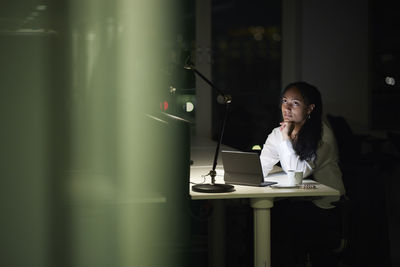 Woman working late in office