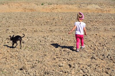 Full length of girl standing on land