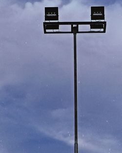 Low angle view of street light against sky