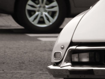 Close-up of car on road