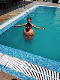 High angle view of man swimming in pool