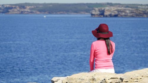 Rear view of woman looking at sea