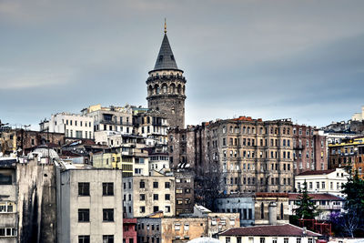 Buildings in city against sky