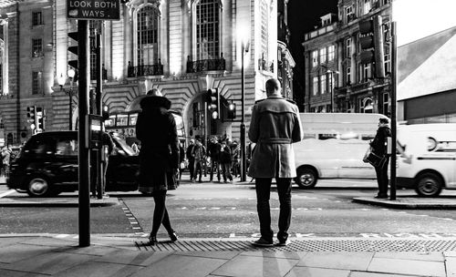 People walking on road in city
