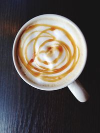 Close-up of cappuccino on table