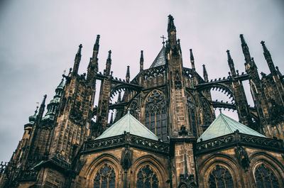 Low angle view of cathedral against cloudy sky