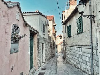 Footpath amidst buildings in town