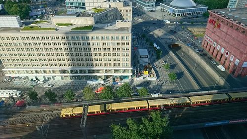 High angle view of train amidst buildings in city