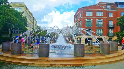 Fountain with buildings in background